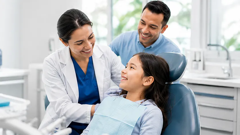 Dentist and family discussing oral health